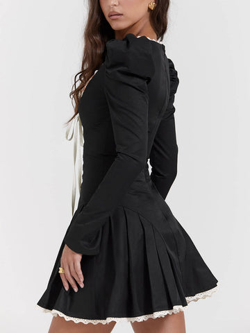 Minivestido plisado negro y crema 
