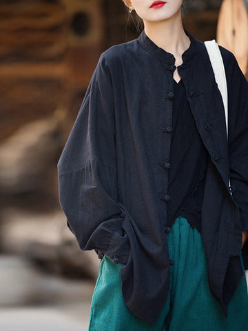 Blusas plisadas de color liso con cuello alto, mangas murciélago y botones de rana chinos sueltos. 