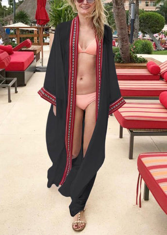 Cárdigan holgado de gasa con lazo en la cintura, bordado en negro y manga larga 