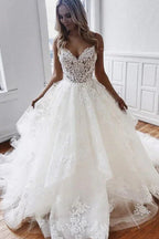 Vestidos de novia glamurosos de corte A con tirantes finos, apliques de encaje y tul 