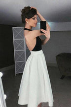 Kurzes Abendkleid mit hochgeschlossenem Neckholder-Oberteil und Faltenrock